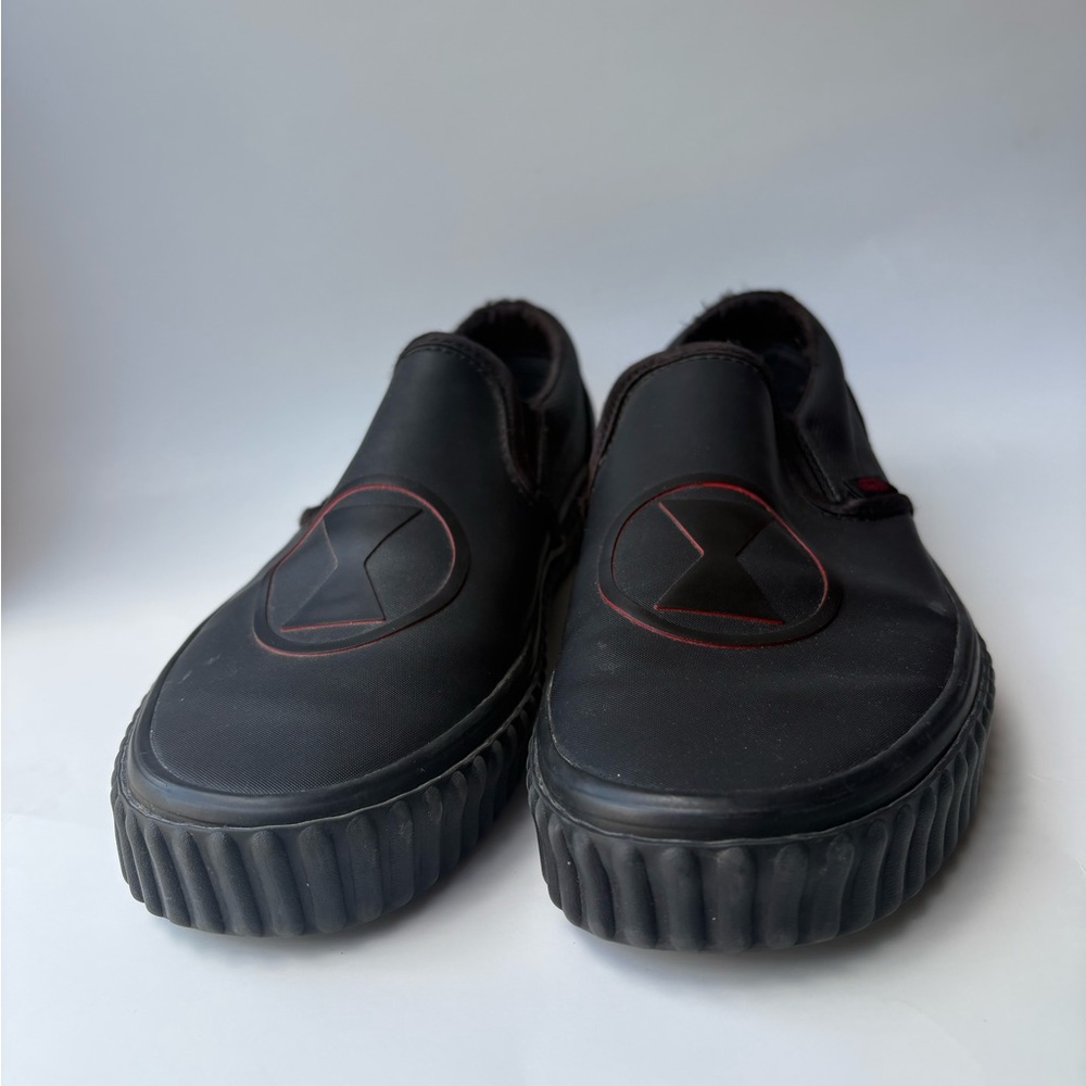 Vans Black Slip-On Sneakers with Red Trim Detail